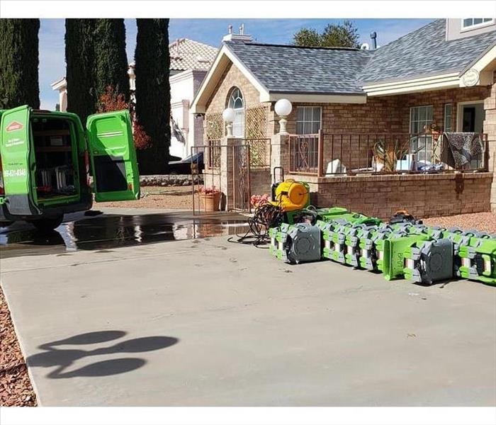 Green SERVPRO Truck Next To Green Air Movers and Dehumidifiers